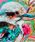 Lilli Rock Tropical Kookaburra Magnet - A close-up painted portrait of a kookaburra bird with turquoise, white, pink, and teal colours, surrounded by floral elements in a colourful abstract style.